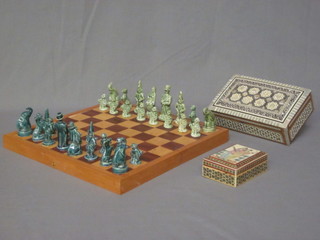 A chess set complete with ceramic pieces, 2 modern Moorish  style boxes