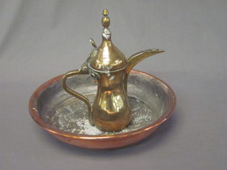 A brass Turkish coffee pot 10" and a circular copper sieve 13"