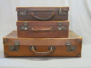 2 leather suitcases and 1 other