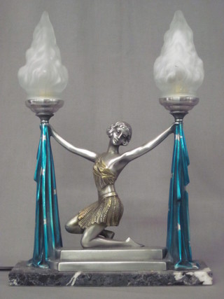 An Art Deco style table lamp in the form of a kneeling girl by a  pair of torches 16"