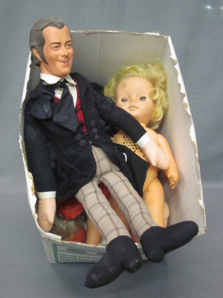 A box containing a Rex Harrison doll and other dolls