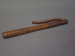 A plain turned wooden truncheon