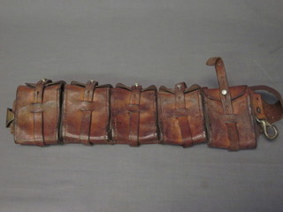 A leather bandolier with 5 cartridge holders