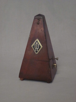 A wooden metronome