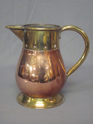 A copper and brass jug 9"
