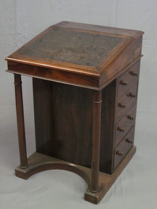 A William IV rosewood Davenport with hinged rising lid, the pedestal fitted 4 long drawers and raised on turned supports 21"