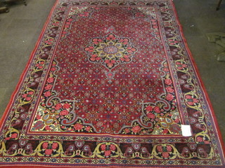 A fine quality contemporary red ground Persian carpet with central medallion within multi-row borders 119" x 83"