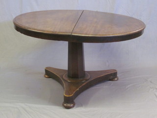 A William IV circular mahogany snap top breakfast table raised on a chamfered column with triform base 46"