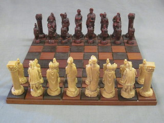 A wooden chessboard and resin chess figures of Romans