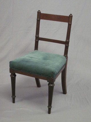 A Victorian mahogany bar back chair with fluted columns to the  side, upholstered seat and raised on turned supports