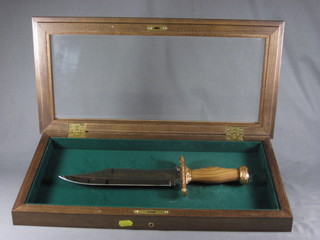 A John Wayne commemorative Bowie knife with 10" blade, contained in a wooden case