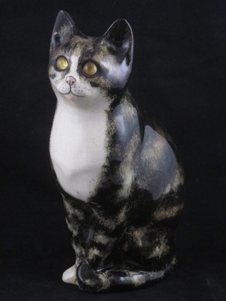A Kensington pottery figure of a seated cat with glass eye, base marked 24 Kensington, signed 8 1/2"