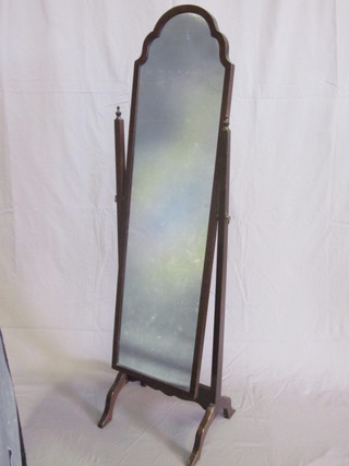 A cheval plate mirror contained in mahogany swing frame  and stand