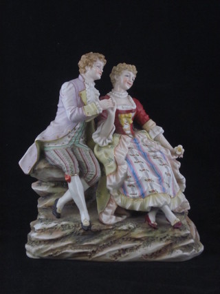 A Continental porcelain figure of a seated lady and gentleman 7"