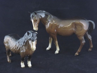 A Beswick figure of a standing bay horse 7" and a Beswick  figure of a Shetland Pony, ear f,