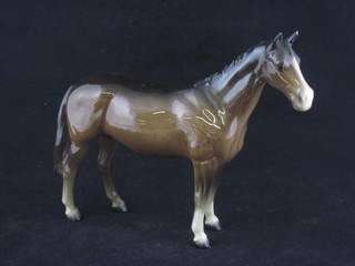 A Beswick figure of a standing bay horse 7"   ILLUSTRATED