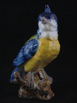 A Majolica style figure of a seated bird, base marked PQ 7",  chip to beak