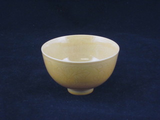 An Oriental yellow glazed tea bowl, the base with character figure mark 3"  ILLUSTRATED