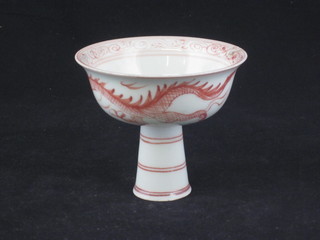 An Oriental porcelain pedestal bowl/cup, the base with 6  character mark, heavily f, 4"