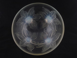 A circular Lalique bowl decorated flower heads, the base marked  R Lalique France 9"  ILLUSTRATED FRONT  COVER