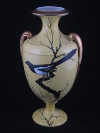 A Cauldon yellow glazed twin handled vase decorated a bird, signed D Birbeck