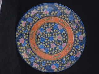 An Oriental style charger with floral decoration 12"
