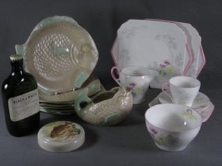 An 8 piece Shelley pattern tea service comprising 2 twin handled  bread and butter plates, 2 tea plates, 2 cups, 2 saucers and a  cream jug - chip to base, base marked CS0149 together with a 7  piece Shorter & Sons fish set with 6 plates and a soup bowl, a pot  lid decorated a fish and an empty vintage bottle of Black &  Whyte Whisky