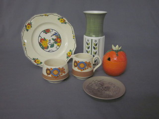A Carltonware preserve jar in the form of an orange, a Royal  Crown Devon vase, a circular Poole Pottery dish decorated a  squirrel, a Sadler cream and sugar bowl and a Windsor ivory  cake plate
