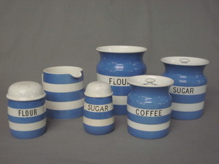 A collection of blue and white striped T G Green & Co Cornish  kitchen ware comprising sugar sifter 4", flour sifter 4 1/2",  circular coffee jar 5", circular sugar jar 6", plain pot 3 1/2", a  flour pot 7" - lid missing, jug 5", 2 cups, circular bowl 5", and  other plates and dishes, all with green shield mark to the base