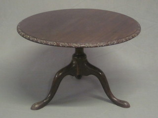A circular Chippendale style mahogany coffee table, raised on  pillar and tripod supports 27"