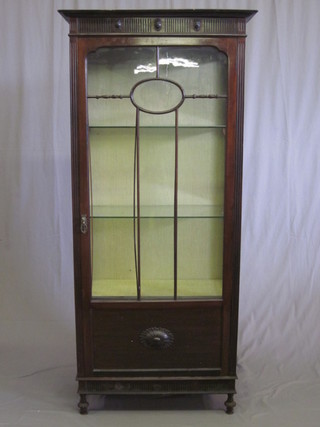 An Edwardian mahogany display cabinet with moulded cornice,  the shelved interior enclosed by astragal glazed panelled doors  28"