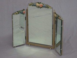 A triple bevelled plate dressing table mirror with barbola mounts