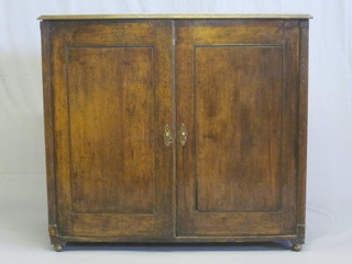 An 18th/19th Century oak cabinet, the interior fitted trays  enclosed by panelled doors, 40"  ILLUSTRATED