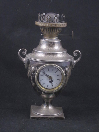 A Victorian embossed silver twin handled oil lamp, base fitted an associated clock, Sheffield 1890