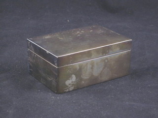 A silver plated cigarette box with hinged lid 4"