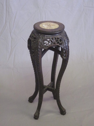 A circular carved and pierced Padouk jardiniere stand with pink  veined marble top 9"