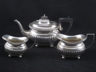 An Edwardian 3 piece silver bachelor's tea service of oval form with demi-reeded decoration, Birmingham 1901 23 ozs