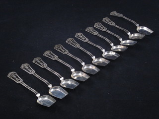 12 Eastern white metal filigree spoons with shovel shaped bowls, 3 ozs
