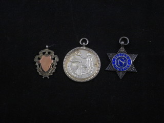 A silver Royal Life Saving Society medal and a silver and  enamelled medal and 1 other