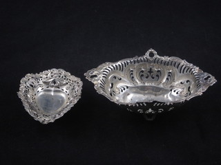 A pierced boat shaped Sterling basket and 1 other small basket