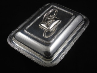 A pair of rectangular silver plated entree dishes and covers