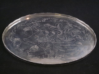 An Eastern engraved oval white metal tray 10"
