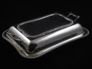 A silver plated twin handled entree dish and cover