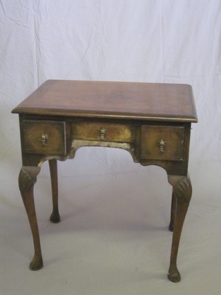 A Queen Anne style walnut low boy with crossbanded top, fitted 1 long and 2 short drawers, raised on cabriole supports 26"