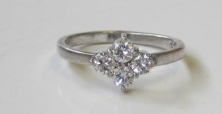 A white gold dress ring set 4 diamonds