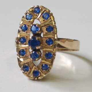 A foreign gold dress ring set blue stones