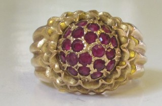 An 18ct gold dress ring set garnets