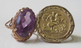 A 9ct gold dress ring set an amethyst and a gilt metal sovereign facsimile ring