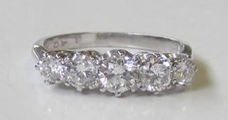 An 18ct white gold engagement/dress ring set 5 diamonds,  approx 1.40ct