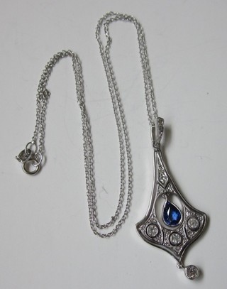An 18ct white gold chain hung a pendant set diamonds and a tear drop cut sapphire
